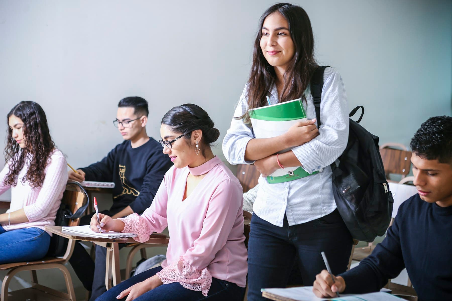 University students learning together in a classroom