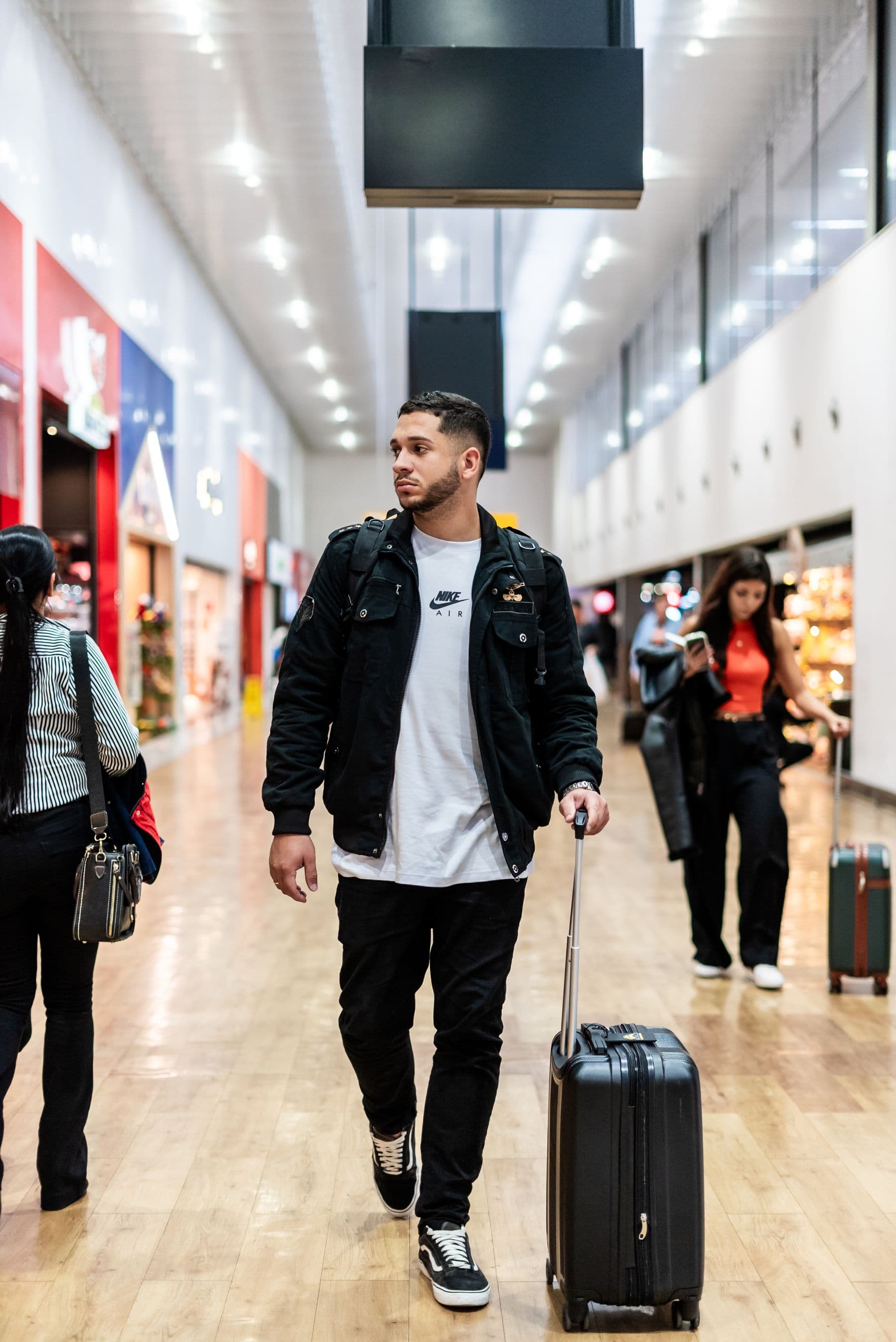 Traveller walking through a modern airport terminal