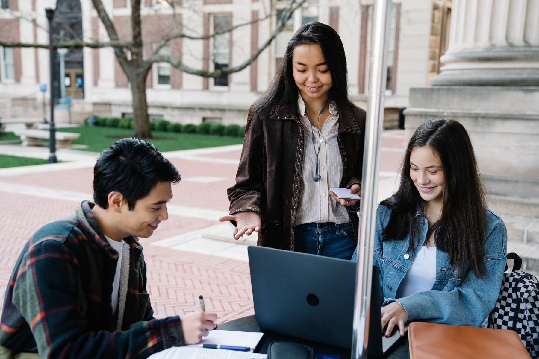 University students studying together outdoors