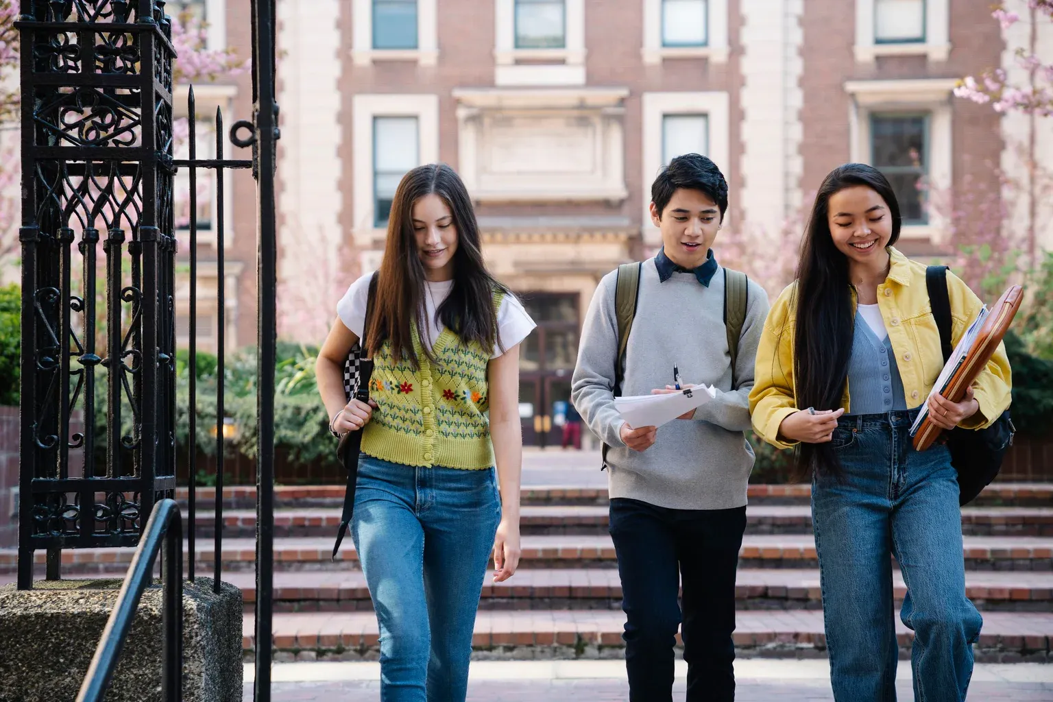 A group of international students walking together on a university campus